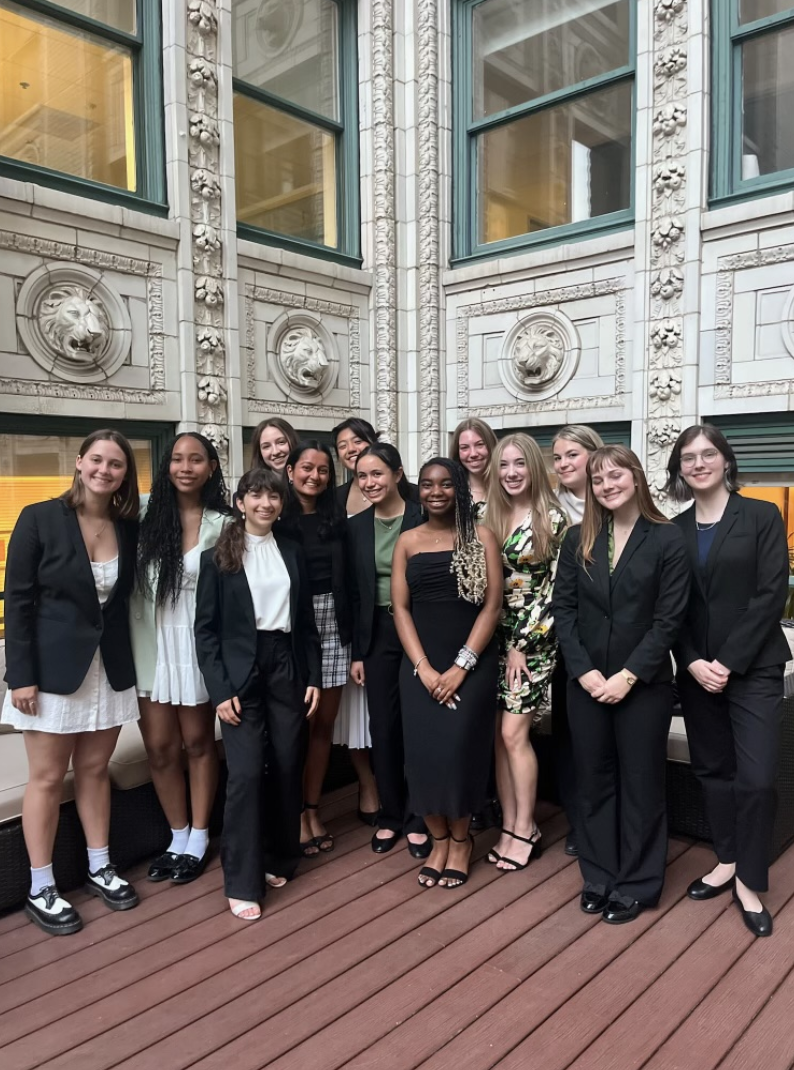 Group of First-Year Fellows in business attire standing together inside a building in Washington, D.C.