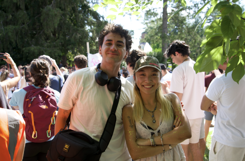 Blogger and his friend hugging each other, smiling as they look at the camera.