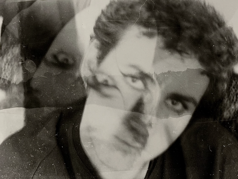 A black and white photo of the blogger confrontationally gazing at the camera. He has dramatic eyeliner that goes up to his temples.