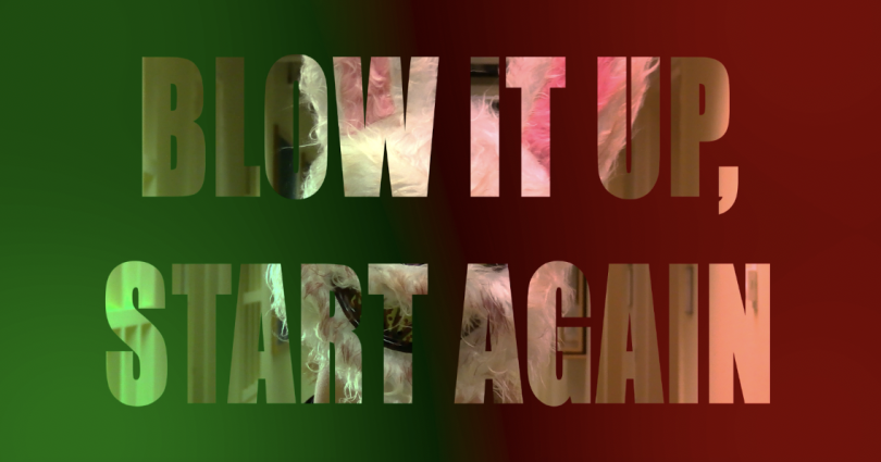 The words "Blow It Up, Start Again" appear in the middle of the image. Each word is transparent, leaving behind the image of the actor in the bunny mask in the hallway. Both sides are colored by edited party lighting so the left side is green