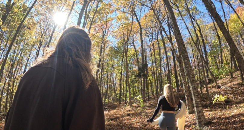 My friends and I hiking through the woods on our way to the tower.