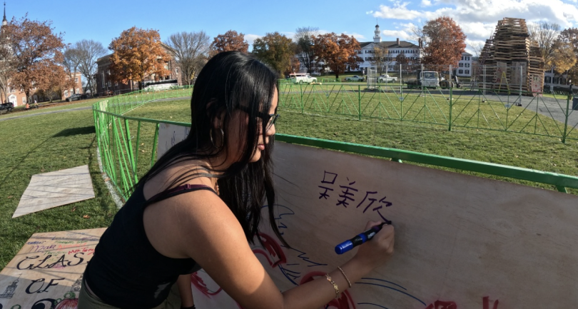 Signing my Chinese name on the Dartmouth Chinese Student Association board, a group on campus I am part of.