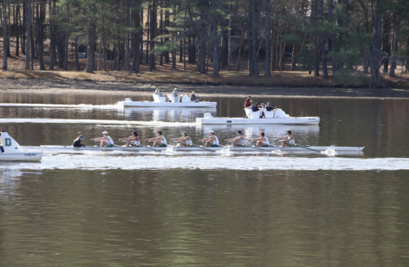 A rowing boat with 8 rowers and a coxswain on the Connecticut River