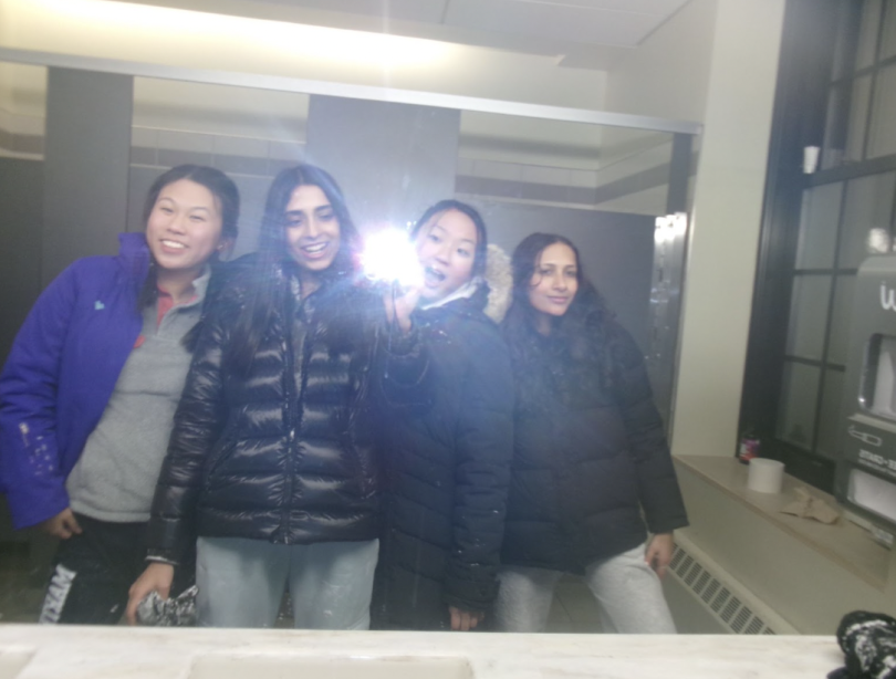 A mirror selfie photo my friends and I took while in the bathroom at FOCO late night.