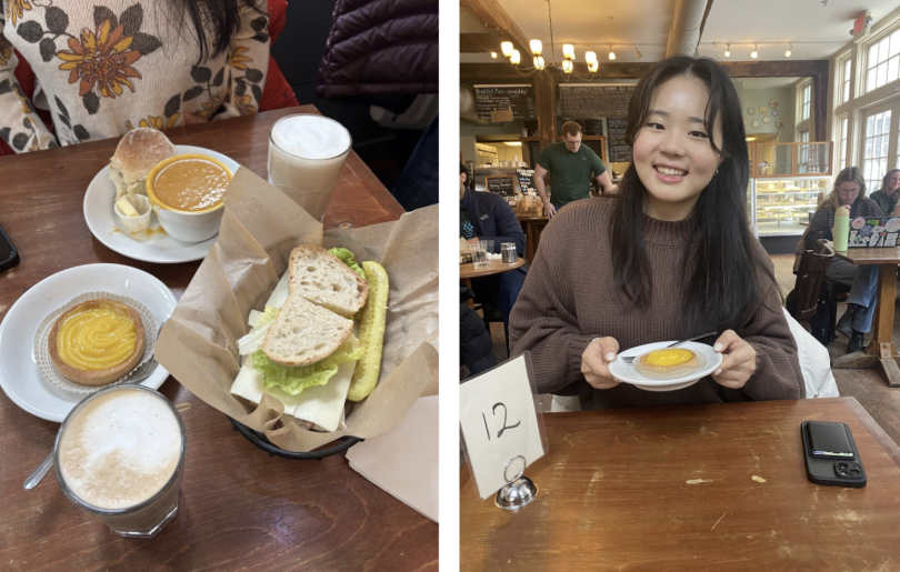 Alt text: A cozy café meal featuring a sandwich with cheese and lettuce, a pickle, a bowl of soup with a roll, two frothy lattes, and a lemon tart on a wooden table. Alt text: A young woman in a brown sweater smiles while holding a lemon tart at a c