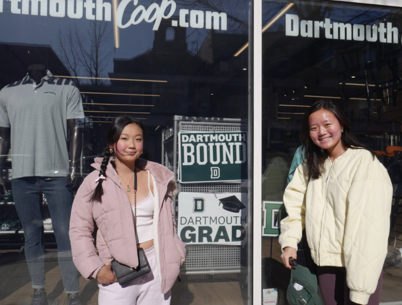 My sister, a graduating senior from the Class of '24, and I, a newly admitted '28, posing in front of a sign outside the Co-op.