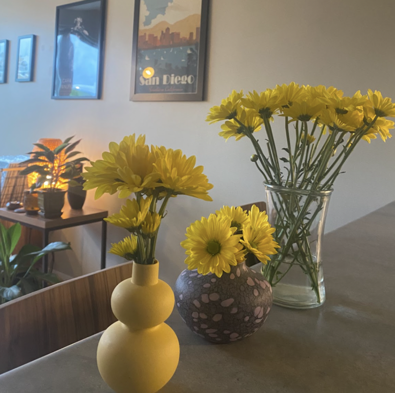 yellow flowers in vases
