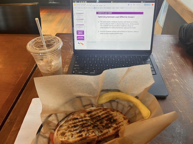 Blogger's sandwich, coffee, and laptop as the blogger works on their slide deck.