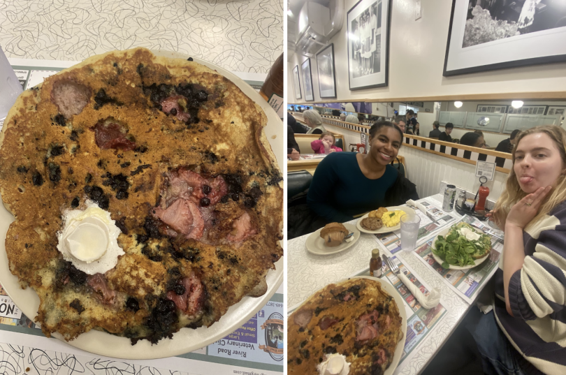 Left: A close-up of a giant mixed berry pancake topped with a scoop of butter, served on a white plate, Right: Two friends sitting in a cozy diner booth with plates of pancakes, eggs, greens, and a muffin spread out in front of them.