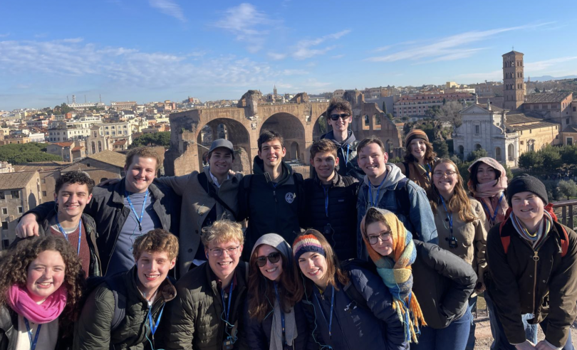 Students standing in front of the Roman Forum