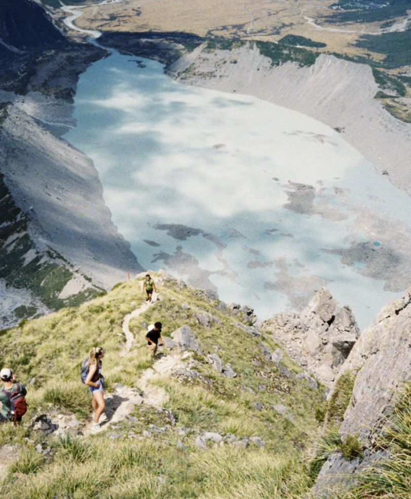 The most insane hike I have ever been on. students on the side of a mountain overlooking a giant glacial lake
