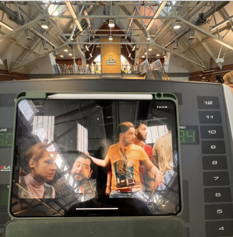 The blogger's iPad shows a movie playing as they watch during an incline walk on the treadmill.