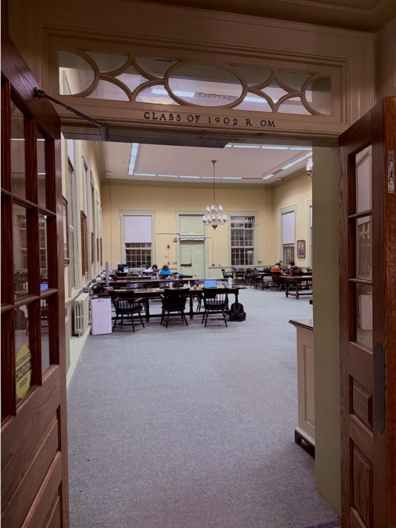 a large room with tables and chairs for studying.