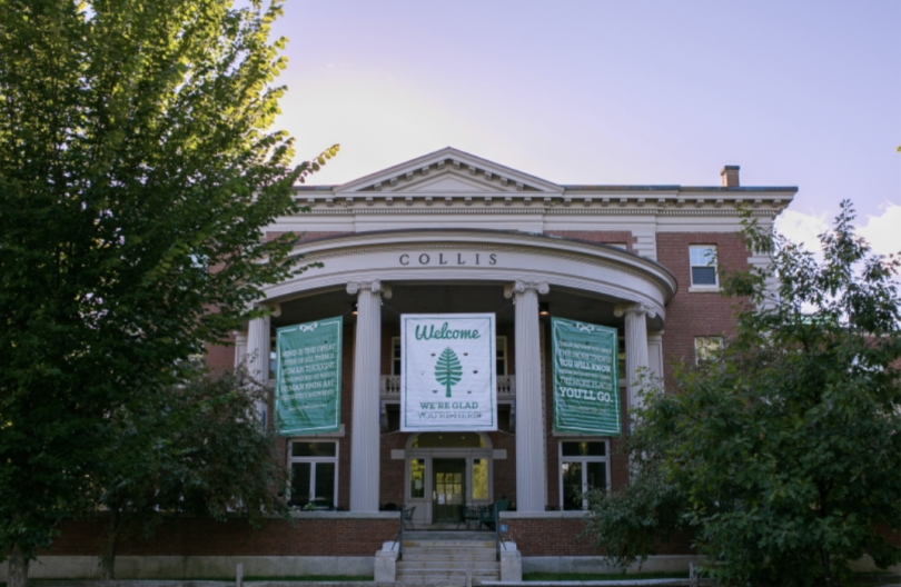 a building with columns named "Collis" and banners that say "Welcome, we are glad you are here."