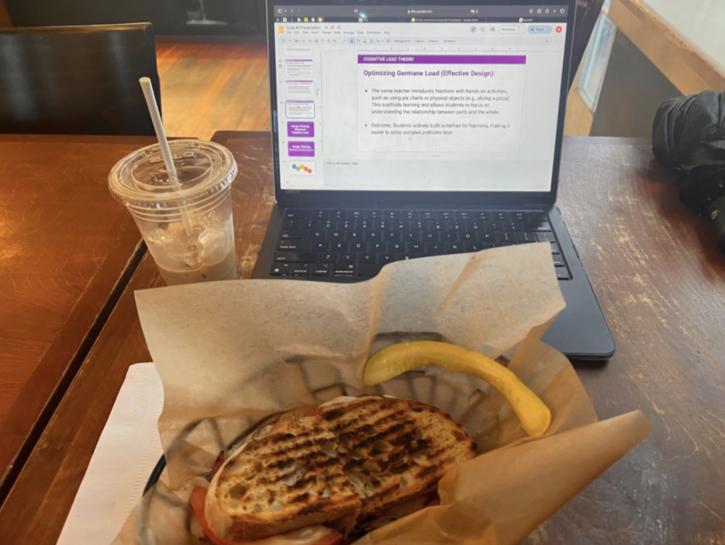 Blogger's sandwich, coffee, and laptop as the blogger works on their slide deck.