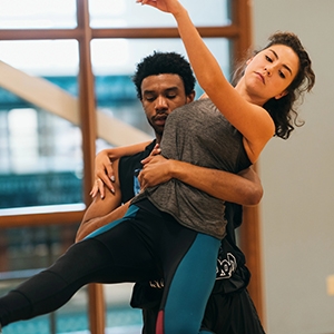 A photo of dancers Veronica Burt '16 and visiting artist Maurice Ivy rehearse INTERIOR (part of VoxLab) in the Pool View Room in Alumin Gym