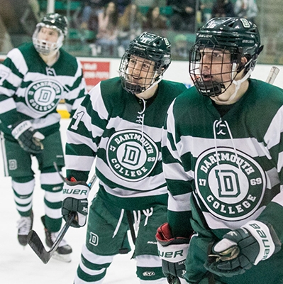 A photo of three members of the men's hockey team