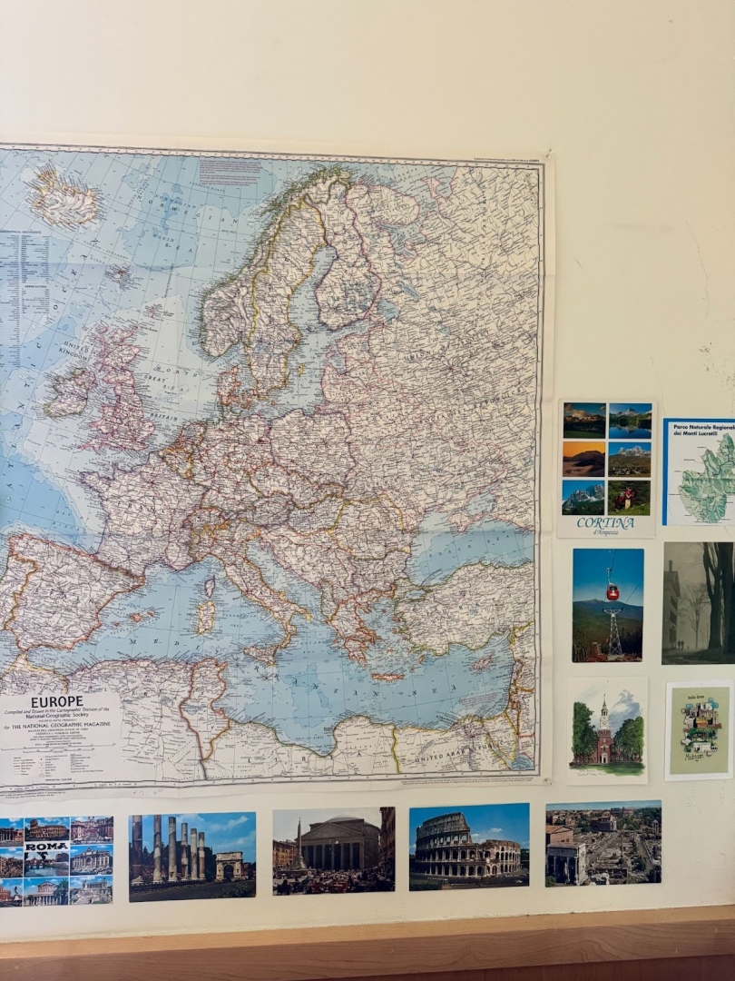 A map of Greece surrounded by postcards from Italy