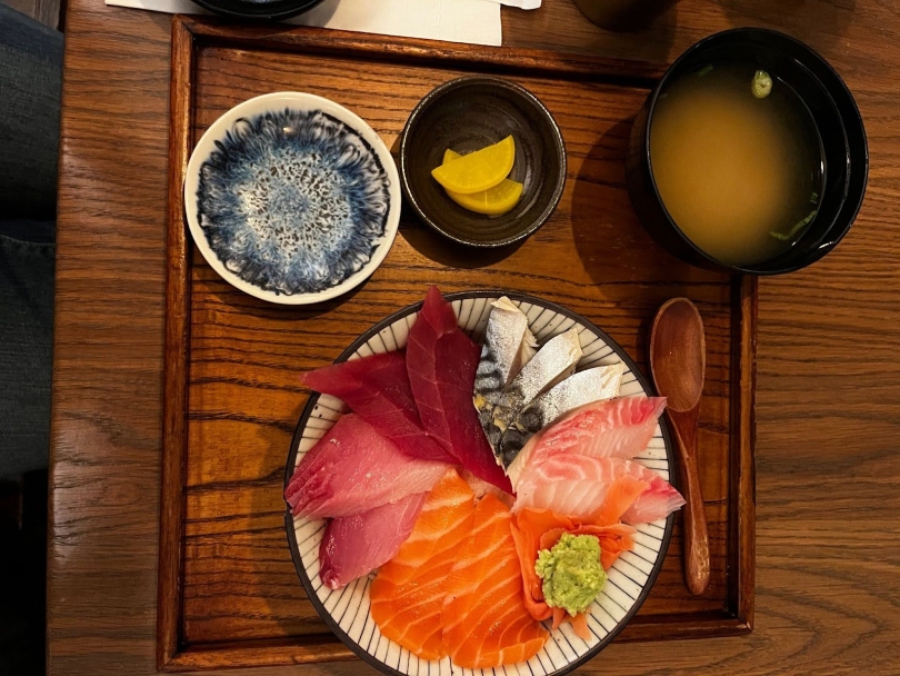 An image of sashimi and miso soup