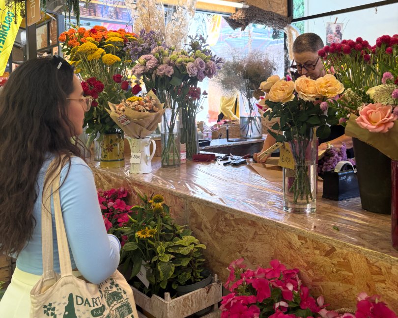 Photo of me getting some flowers for my apartment at the supermarket!