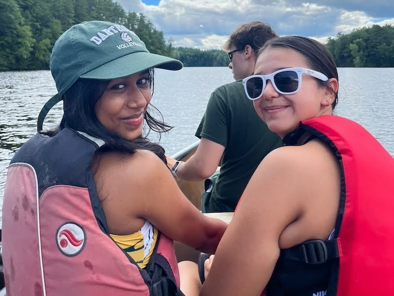 An image of two students in a canoe on the Connecticut River