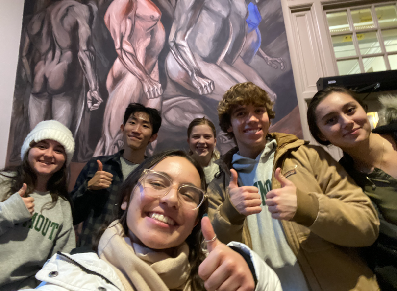 Photo of my friends and I posing in front of one of the Panels in the Orozco mural room for our writing class.