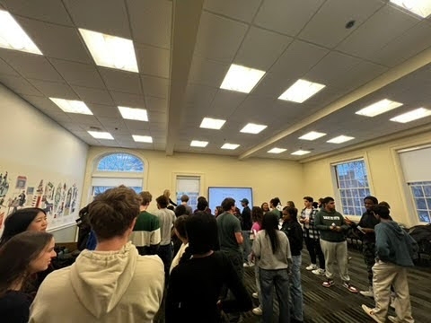 Students gathering and chatting inside a room