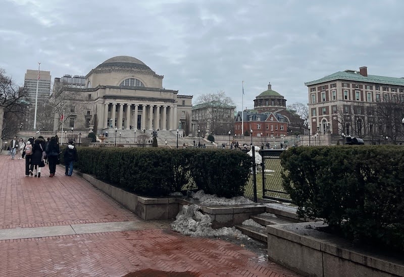  An image of Columbia University buildings against a grey sky