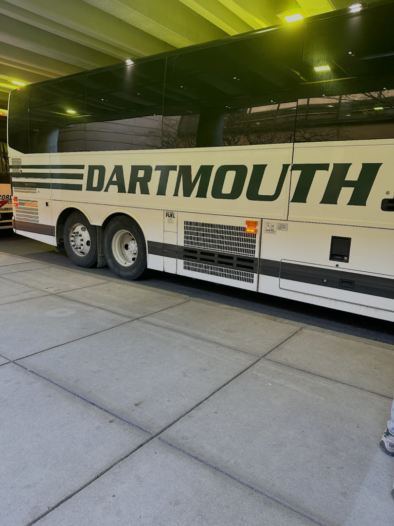 Picture of a green and white bus with the word Dartmouth on it.