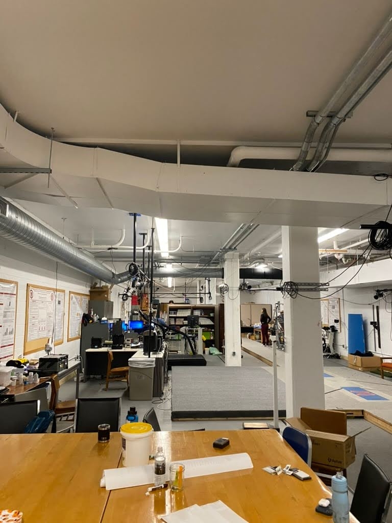 The biomechanics lab, a long room filled with cameras, cables, and miscellaneous athletic equipment 