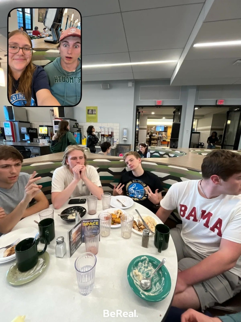 A screenshot of a BeReal in the dining hall, with several of my friends sitting at a booth