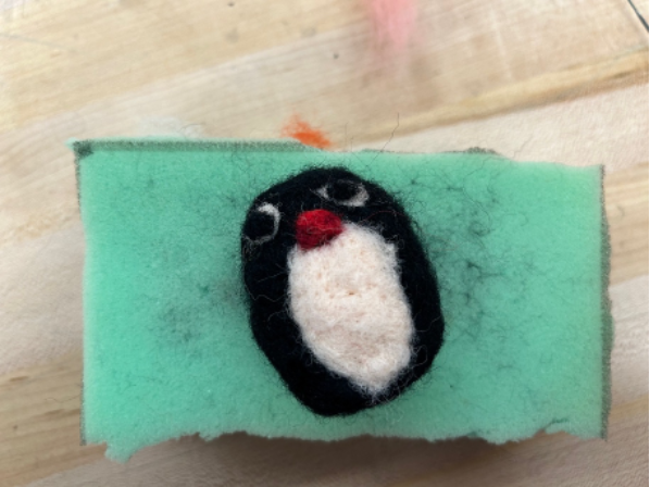 Needle felted penguin with eyes