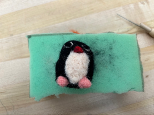Needle felted penguin with feet
