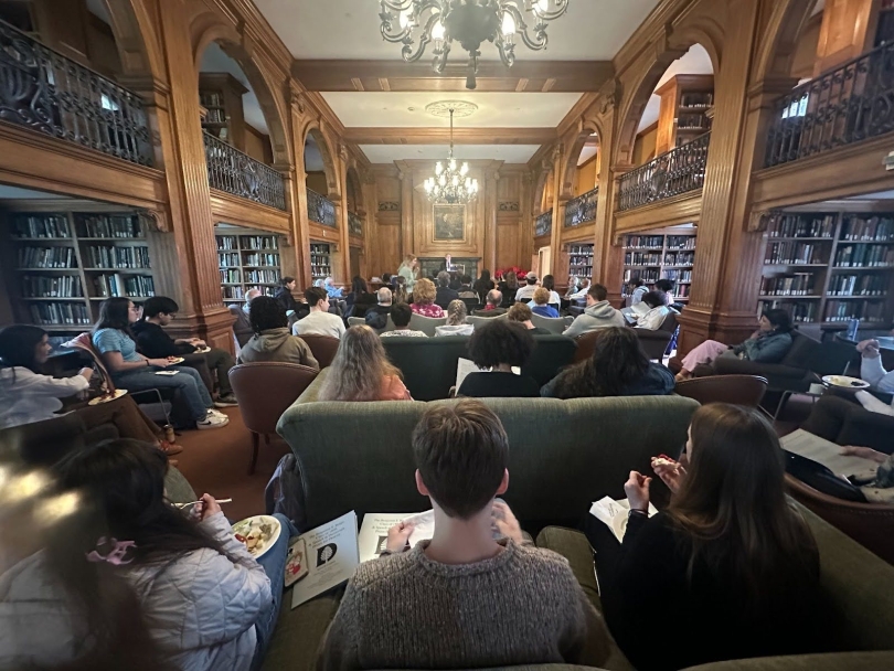 students gathered and sitting inside Sanborn library