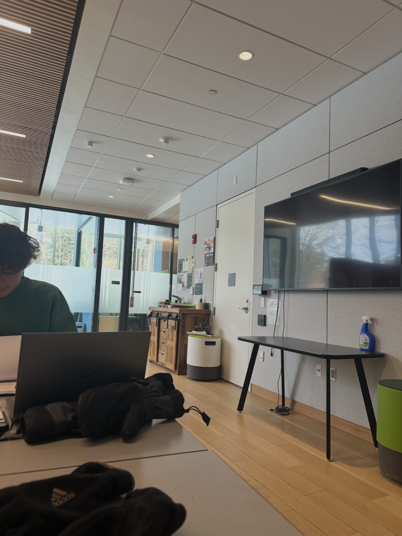 Picture of a study room with a TV and tables.