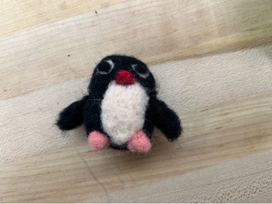 A complete needle felted penguin