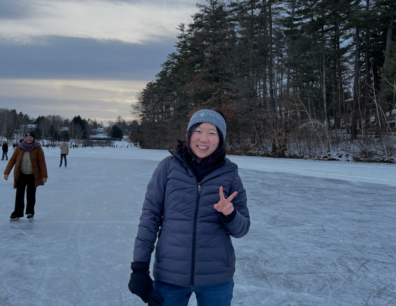 Olivia Koo posing in front of the camera on Occom Pond