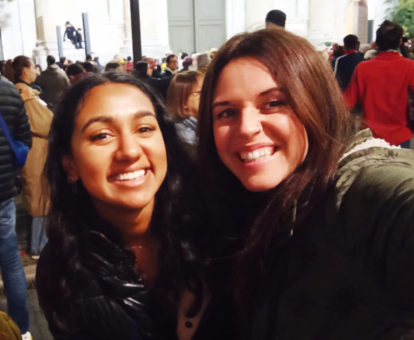 two women smile for a selfie