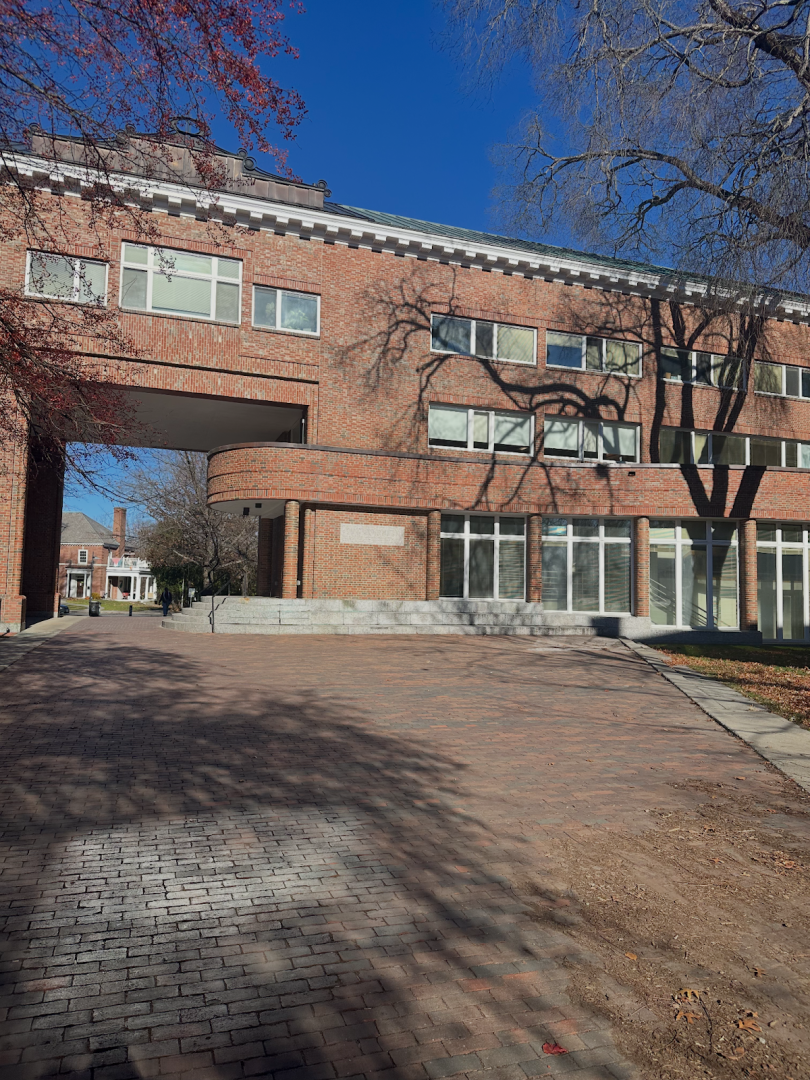 Picture of a brick building with various sized windows.