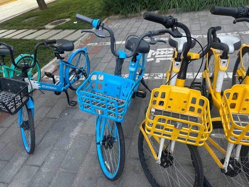 Blue and yellow bikes on the street