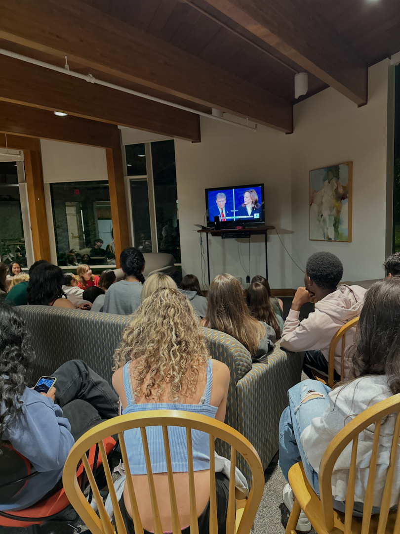 Group of students watching the television.