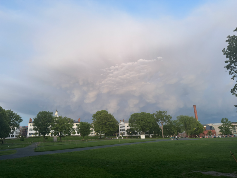 A picture taken on the Green in the middle of campus after a rainstorm with ominous-looking, yet beautiful, gumdrop clouds