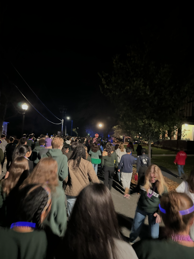 Picture of a group of people walking on the street.