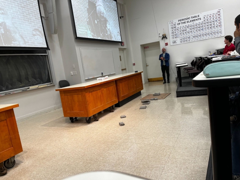 An image of a lecture hall with a physics demonstration