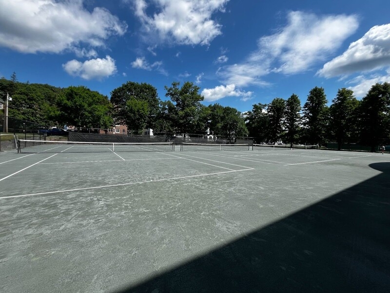 An image of the Dartmouth clay courts on a sunny day