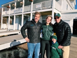 Family at Foot of the Charles. Family smiling at race.