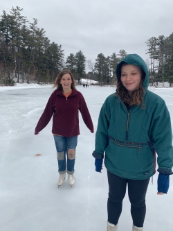 Abbi and a friend skating on Occom pond