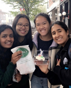 Me and my friends holding the desserts from Lou's.