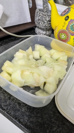 A picture of a cut-up yellow mellon that is similar to a honeydew mellon.