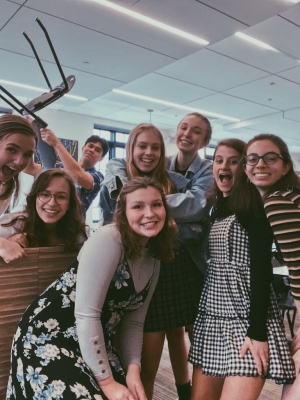 Abbi and 6 friends smiling in the dining hall